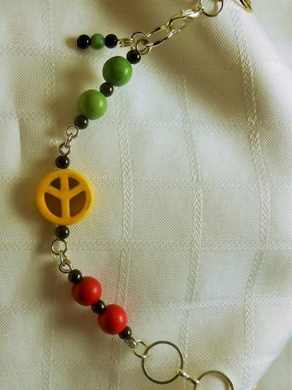 No 226 Handmade necklace with polished stones and Peace sign